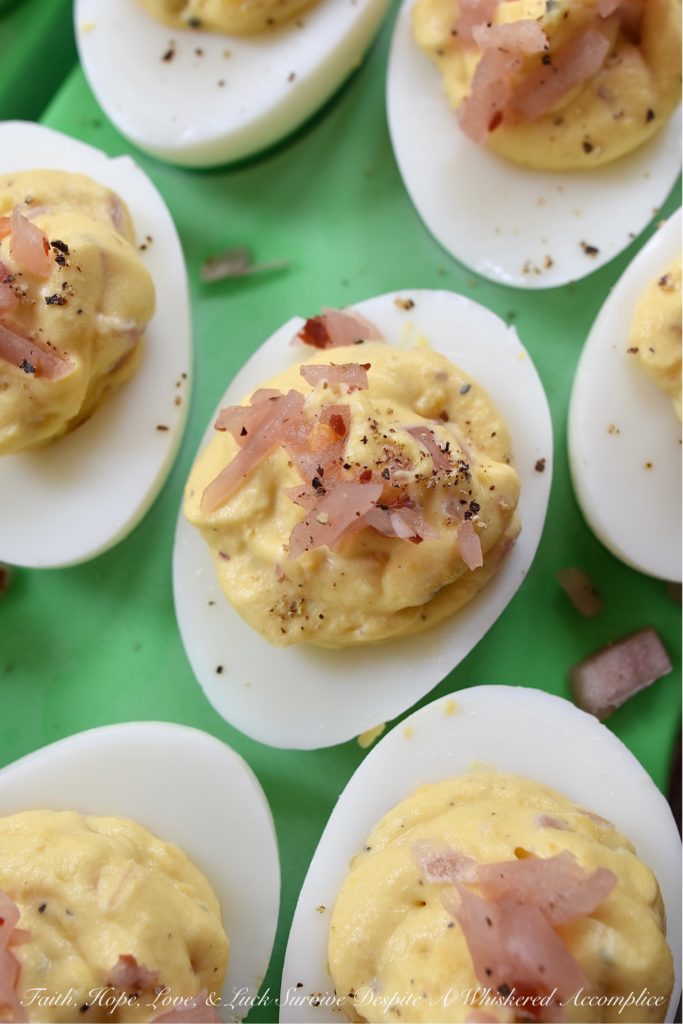 Black Pepper & Pickled Red Onion Deviled Eggs - What happens when you add pickled red onions to a traditional deviled egg recipe? The result is a delicious deviled egg with a sweet, tangy, and bright oniony flavor. These deviled eggs are a must-try, especially if you're the type of person who tends to avoid recipes calling for uncooked onions. I'm fairly certain that these black pepper and pickled red onion-filled deviled eggs will most definitely win your taste buds over.