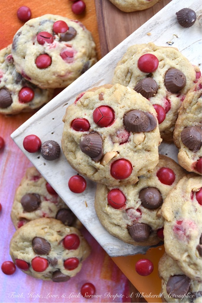 Nutty M&M Peanut Butter Cup Valentine Cookies - Unfortunately, Valentine's Day only comes around once a year. That means, that this may be your only chance, to enjoy these nutty peanut butter cup cookies chock-full of festive holiday M&M's. So, if you love festive holiday-themed cookies, make sure to share a few of these sweet, over-loaded with goodness, irresistible M&M cookies with your special Valentine.
