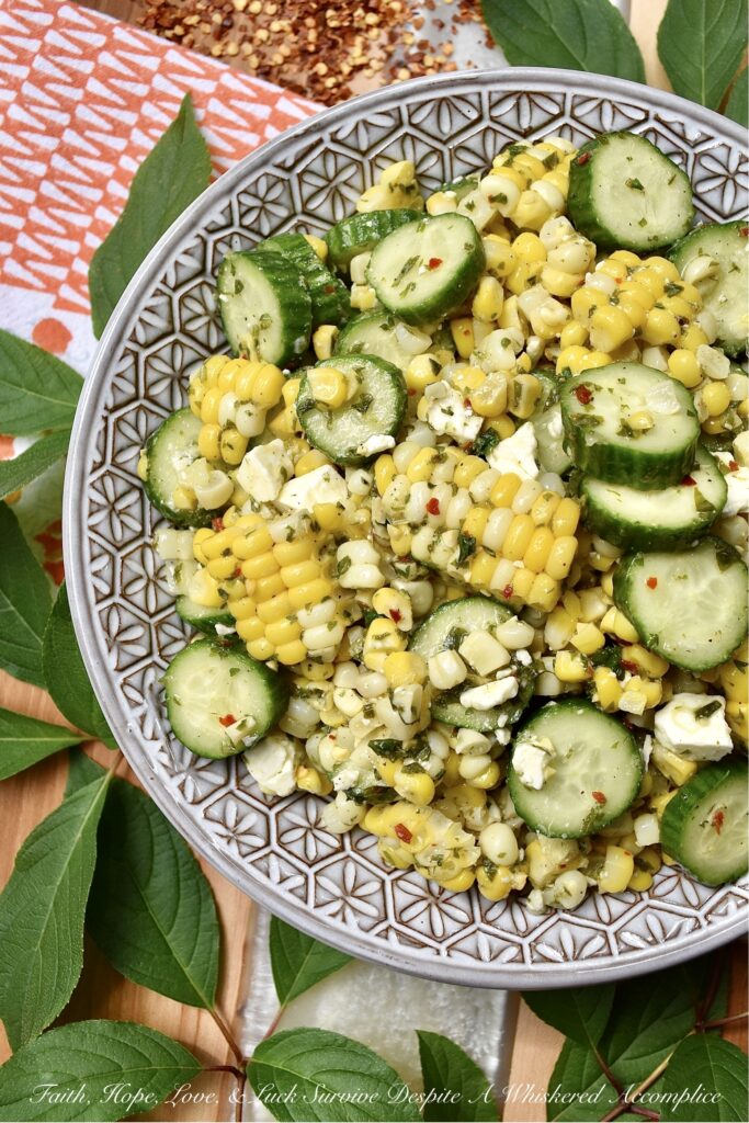 Greek Summer Corn & Cucumber Salad with Feta - You can only eat corn on the cob so many times during the hot summer months before it becomes just a wee bit boring and mundane. This Greek corn and cucumber salad with feta cheese will help to break the monotony. It's fresh, holds up well in hot weather, uses ingredients that are readily available during the steamy summer months, and it is quick and easy to throw together on a busy weekday or a lazy weekend. When it comes to fresh corn, don't be afraid to switch things up this summer with this tasty vegetable side salad.