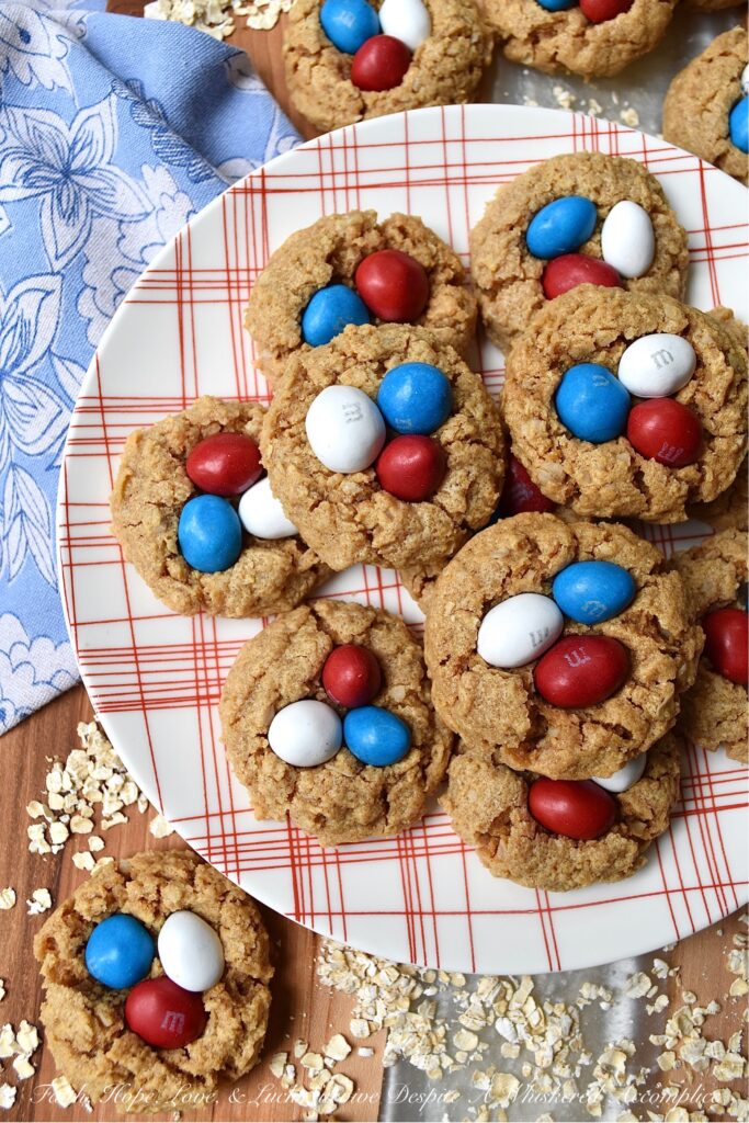 Flourless Peanut Butter M&M's Oatmeal Cookies - These six-ingredient flourless oatmeal cookies have everything you could ever want in a cookie. They're soft, crunchy, and chocolatey all at the same time. And, as an added bonus, you won't even need a mixer for this easy-to-make peanut butter cookie recipe. How great is that? Less clean-up and more time to eat delicious cookies topped with everyone's favorite Peanut M&M's.