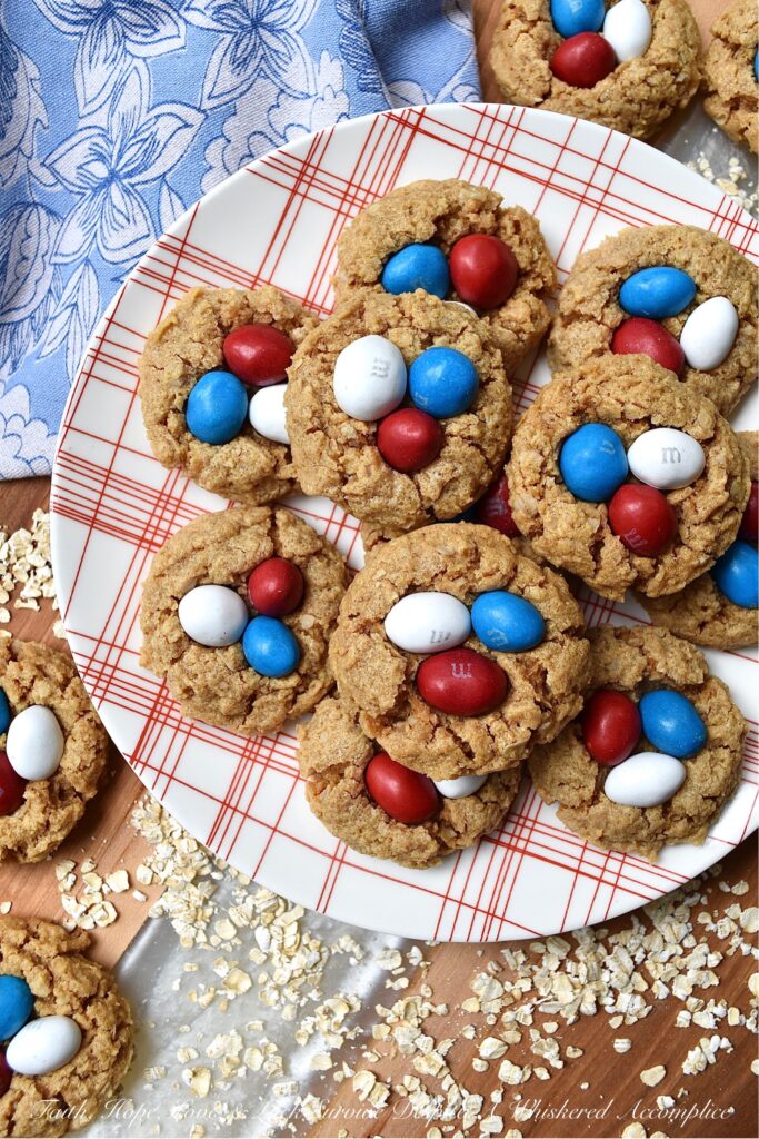 Flourless Peanut Butter M&M's Oatmeal Cookies - These six-ingredient flourless oatmeal cookies have everything you could ever want in a cookie. They're soft, crunchy, and chocolatey all at the same time. And, as an added bonus, you won't even need a mixer for this easy-to-make peanut butter cookie recipe. How great is that? Less clean-up and more time to eat delicious cookies topped with everyone's favorite Peanut M&M's.