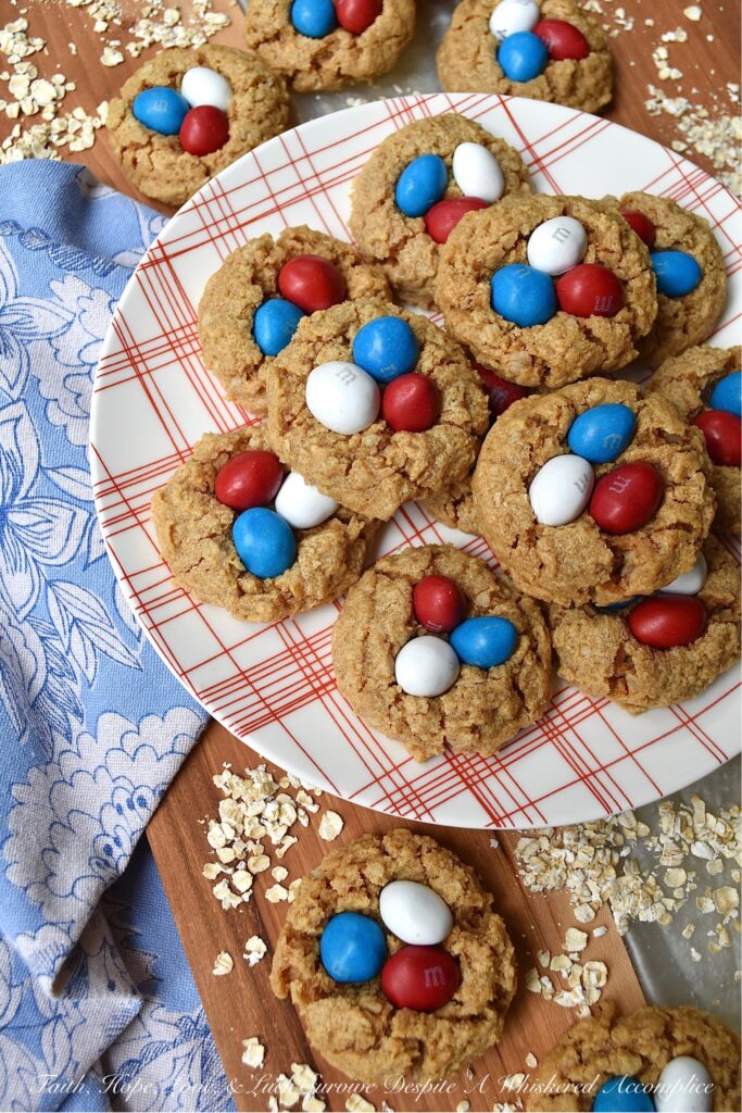 Flourless Peanut Butter M&M's Oatmeal Cookies - These six-ingredient flourless oatmeal cookies have everything you could ever want in a cookie. They're soft, crunchy, and chocolatey all at the same time. And, as an added bonus, you won't even need a mixer for this easy-to-make peanut butter cookie recipe. How great is that? Less clean-up and more time to eat delicious cookies topped with everyone's favorite Peanut M&M's.