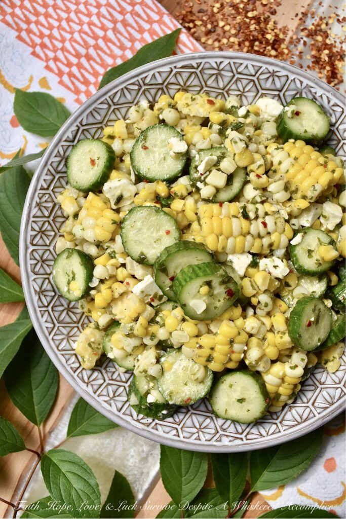 Greek Summer Corn & Cucumber Salad with Feta - You can only eat corn on the cob so many times during the hot summer months before it becomes just a wee bit boring and mundane. This Greek corn and cucumber salad with feta cheese will help to break the monotony. It's fresh, holds up well in hot weather, uses ingredients that are readily available during the steamy summer months, and it is quick and easy to throw together on a busy weekday or a lazy weekend. When it comes to fresh corn, don't be afraid to switch things up this summer with this tasty vegetable side salad.