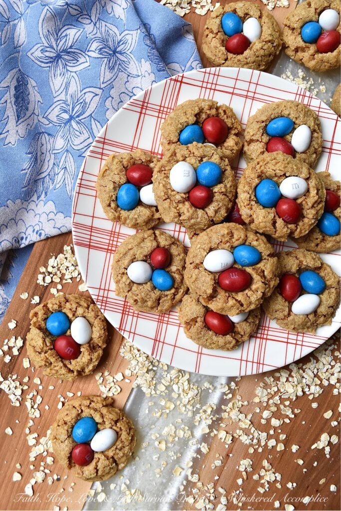 Flourless Peanut Butter M&M's Oatmeal Cookies - These six-ingredient flourless oatmeal cookies have everything you could ever want in a cookie. They're soft, crunchy, and chocolatey all at the same time. And, as an added bonus, you won't even need a mixer for this easy-to-make peanut butter cookie recipe. How great is that? Less clean-up and more time to eat delicious cookies topped with everyone's favorite Peanut M&M's.