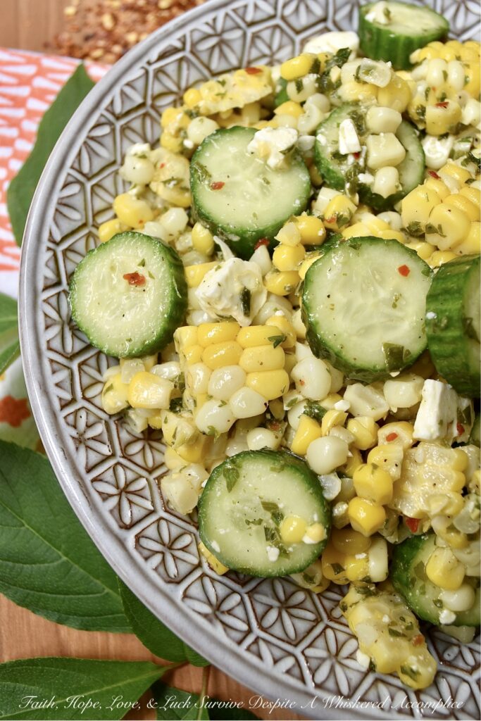 Greek Summer Corn & Cucumber Salad with Feta - You can only eat corn on the cob so many times during the hot summer months before it becomes just a wee bit boring and mundane. This Greek corn and cucumber salad with feta cheese will help to break the monotony. It's fresh, holds up well in hot weather, uses ingredients that are readily available during the steamy summer months, and it is quick and easy to throw together on a busy weekday or a lazy weekend. When it comes to fresh corn, don't be afraid to switch things up this summer with this tasty vegetable side salad.