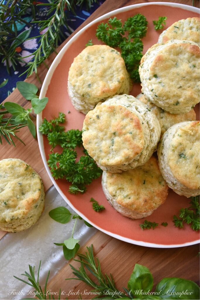Buttery Fresh Herb Breakfast Biscuits - Is your herb garden overflowing with parsley, oregano, chives, rosemary, or basil? If so, these buttery biscuits, made with fresh herbs, are just what you need to bake for breakfast. They're flaky, warm, tender, fluffy, super-buttery, and even more amazing when served topped with your favorite fruity jam, thick preserves, or sweet jelly.