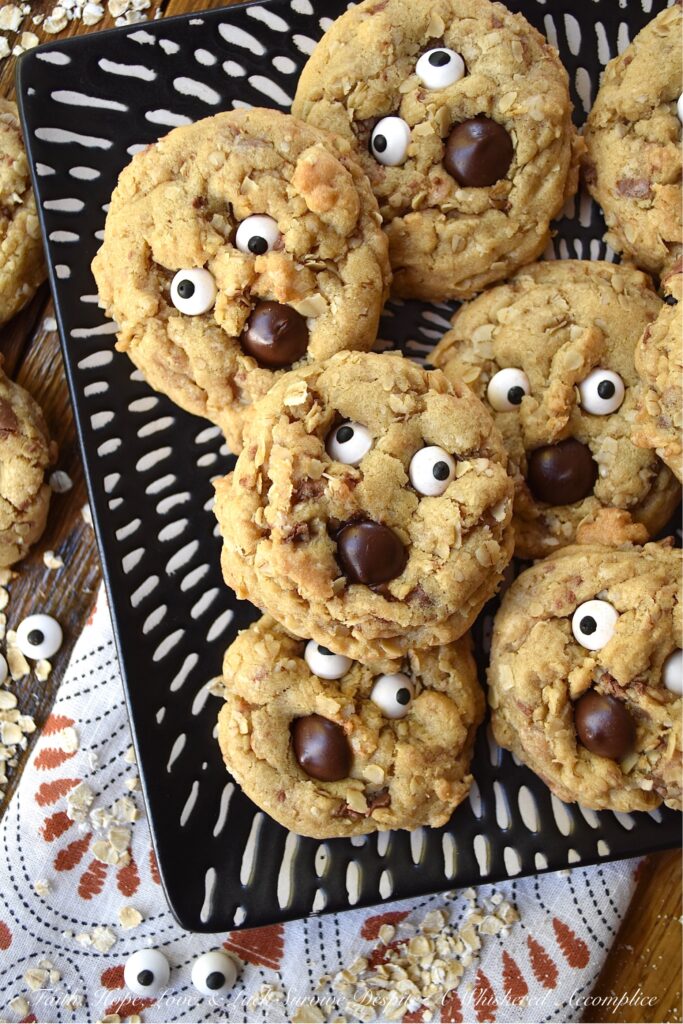 Oatmeal Chocolate Toffee Ghost Cookies - Halloween is the perfect time of year to make a "boo"tiful sweet treat for your family and friends. These adorable ghost cookies are filled with chewy oatmeal and crunchy milk chocolate-coated toffee. Once these fa"boo"lous HEATH toffee bar cookies are garnished with edible candy eyeballs and a chocolate chip mouth, there's simply no way to resist their holiday charm.