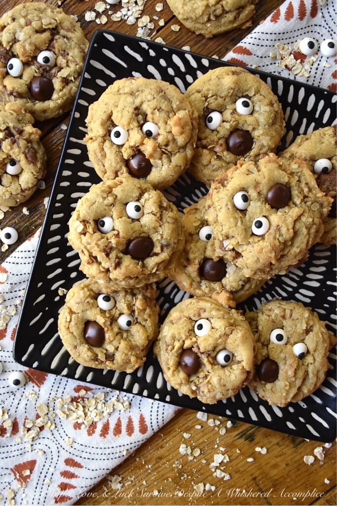 Oatmeal Chocolate Toffee Ghost Cookies - Halloween is the perfect time of year to make a "boo"tiful sweet treat for your family and friends. These adorable ghost cookies are filled with chewy oatmeal and crunchy milk chocolate-coated toffee. Once these fa"boo"lous HEATH toffee bar cookies are garnished with edible candy eyeballs and a chocolate chip mouth, there's simply no way to resist their holiday charm.