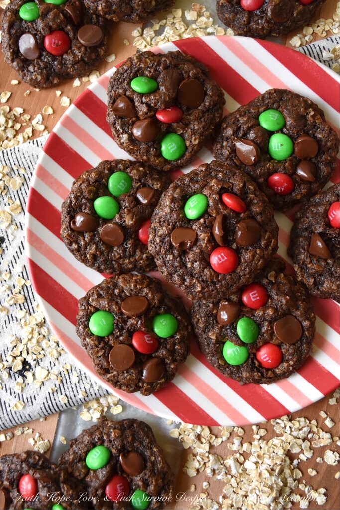 Chocolate Fudge Brownie Oatmeal M&M Cookies - When you can’t decide between an oatmeal cookie, a chocolate fudge brownie, or a handful of M&M’s, bake up a batch of these Chocolate Fudge Brownie Oatmeal M&M Cookies. You can satisfy all of your cravings with one rich, delicious, and super-chocolatey cookie and spread a little bit of seasonal cheer with the addition of festive holiday M&M’s.