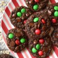 Chocolate Fudge Brownie Oatmeal M&M Cookies - When you can’t decide between an oatmeal cookie, a chocolate fudge brownie, or a handful of M&M’s, bake up a batch of these Chocolate Fudge Brownie Oatmeal M&M Cookies. You can satisfy all of your cravings with one rich, delicious, and super-chocolatey cookie and spread a little bit of seasonal cheer with the addition of festive holiday M&M’s.