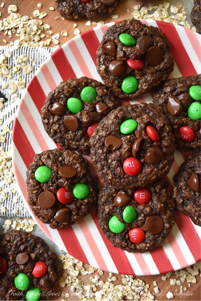 Chocolate Fudge Brownie Oatmeal M&M Cookies - When you can’t decide between an oatmeal cookie, a chocolate fudge brownie, or a handful of M&M’s, bake up a batch of these Chocolate Fudge Brownie Oatmeal M&M Cookies. You can satisfy all of your cravings with one rich, delicious, and super-chocolatey cookie and spread a little bit of seasonal cheer with the addition of festive holiday M&M’s.