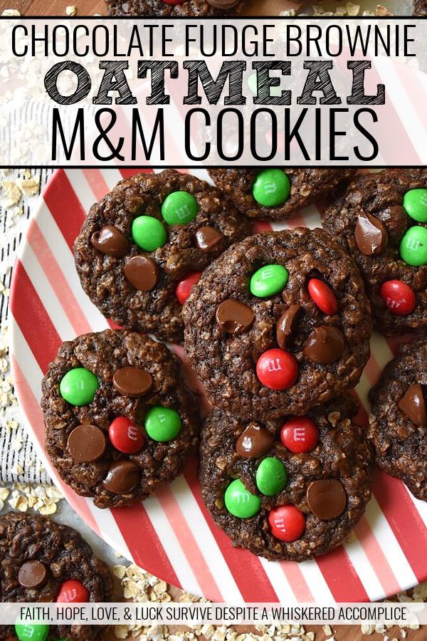 Chocolate Fudge Brownie Oatmeal M&M Cookies - When you can’t decide between an oatmeal cookie, a chocolate fudge brownie, or a handful of M&M’s, bake up a batch of these Chocolate Fudge Brownie Oatmeal M&M Cookies. You can satisfy all of your cravings with one rich, delicious, and super-chocolatey cookie and spread a little bit of seasonal cheer with the addition of festive holiday M&M’s.