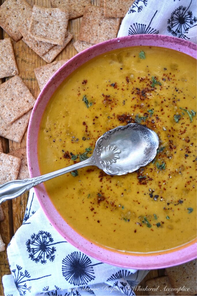 Creamy Chili & Herb Sweet Potato & Onion Soup - This creamy vegetable and herb soup is a lovely budget-friendly and healthy meal option for a busy weeknight since it only requires one sweet potato, one sweet yellow onion, a carton of store-bought broth, and a few readily available kitchen herbs and seasonings. Add in some heavy whipping cream, half and half, or milk before blending to give this warm chili-spiced soup a creamy, smooth, and rich consistency.