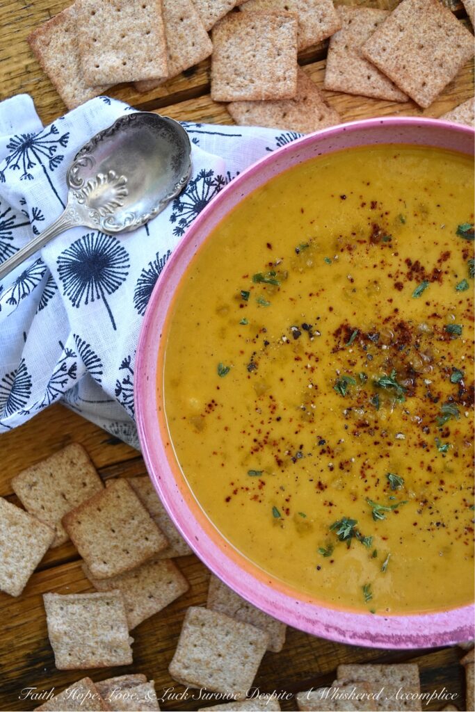 Creamy Chili & Herb Sweet Potato & Onion Soup - This creamy vegetable and herb soup is a lovely budget-friendly and healthy meal option for a busy weeknight since it only requires one sweet potato, one sweet yellow onion, a carton of store-bought broth, and a few readily available kitchen herbs and seasonings. Add in some heavy whipping cream, half and half, or milk before blending to give this warm chili-spiced soup a creamy, smooth, and rich consistency.