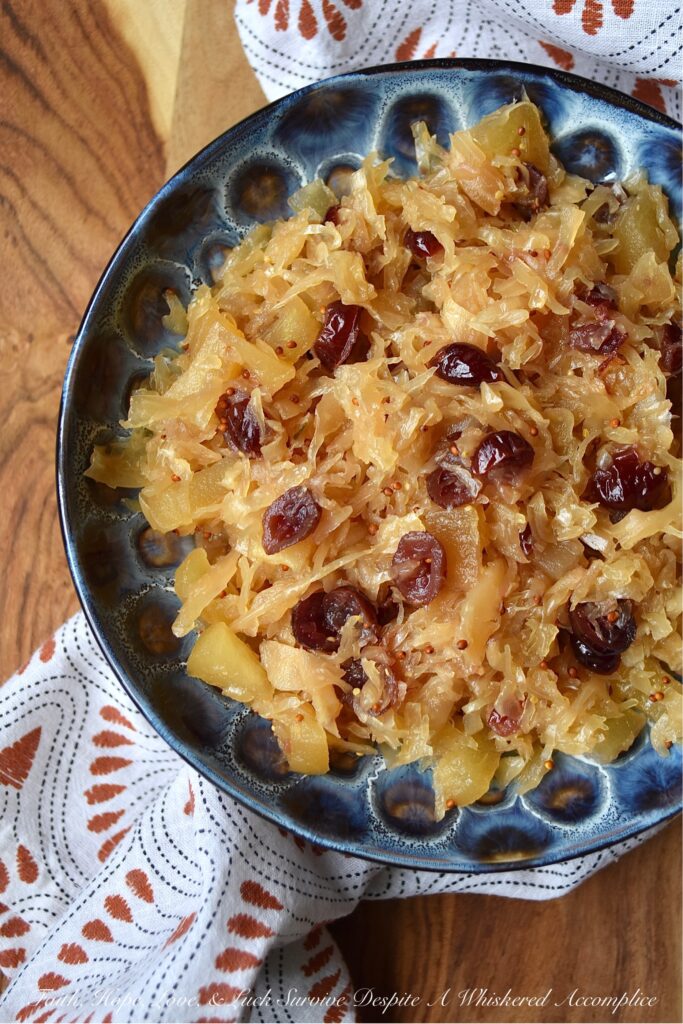 Apple & Cranberry Oven-Roasted Sauerkraut - This sweet and sour one-dish recipe is one that will help you navigate mealtime on almost any busy weeknight. Not only is it the perfect side dish for any type of pork or sausage, but it also pairs extremely well with mashed potatoes. And, thanks to an apple, a few dried sweetened cranberries, and a touch of brown sugar, this oven-roasted sauerkraut has just the right amount of sweetness to help balance out its naturally sour flavor.