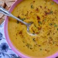 Creamy Chili & Herb Sweet Potato & Onion Soup - This creamy vegetable and herb soup is a lovely budget-friendly and healthy meal option for a busy weeknight since it only requires one sweet potato, one sweet yellow onion, a carton of store-bought broth, and a few readily available kitchen herbs and seasonings. Add in some heavy whipping cream, half and half, or milk before blending to give this warm chili-spiced soup a creamy, smooth, and rich consistency.