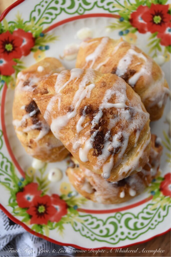 Crescent-Wrapped Cinnamon Apple Slices - These crescent-wrapped cinnamon apple slices, served with a heavy whipping cream glaze, can be enjoyed for breakfast, brunch, or dessert. Take your pick. Or, sinfully gobble them up for all three. These sweet glazed pastry treats are super easy to make and only require a package of refrigerated crescent rolls, an apple, and a few other simple ingredients which you most likely have on hand in your pantry or in your fridge.