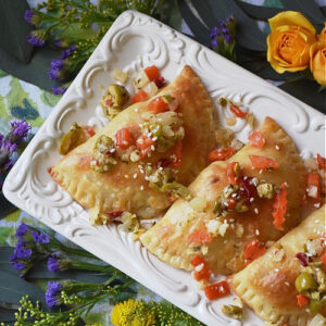 Unique & Creative Cajun Recipes for Mardi Gras - When it comes to Mardi Gras food, po' boy sandwiches, jambalaya, and shrimp étouffée are the norm. However, this unique Mardi Gras recipe round-up is a bit more creative. You'll find recipes like muffuletta empanadas and king cake croissants, not to mention several Cajun soup, stew, and chowder recipes. If you're looking for unique and creative Cajun Mardi Gras recipes, we've totally got you covered.