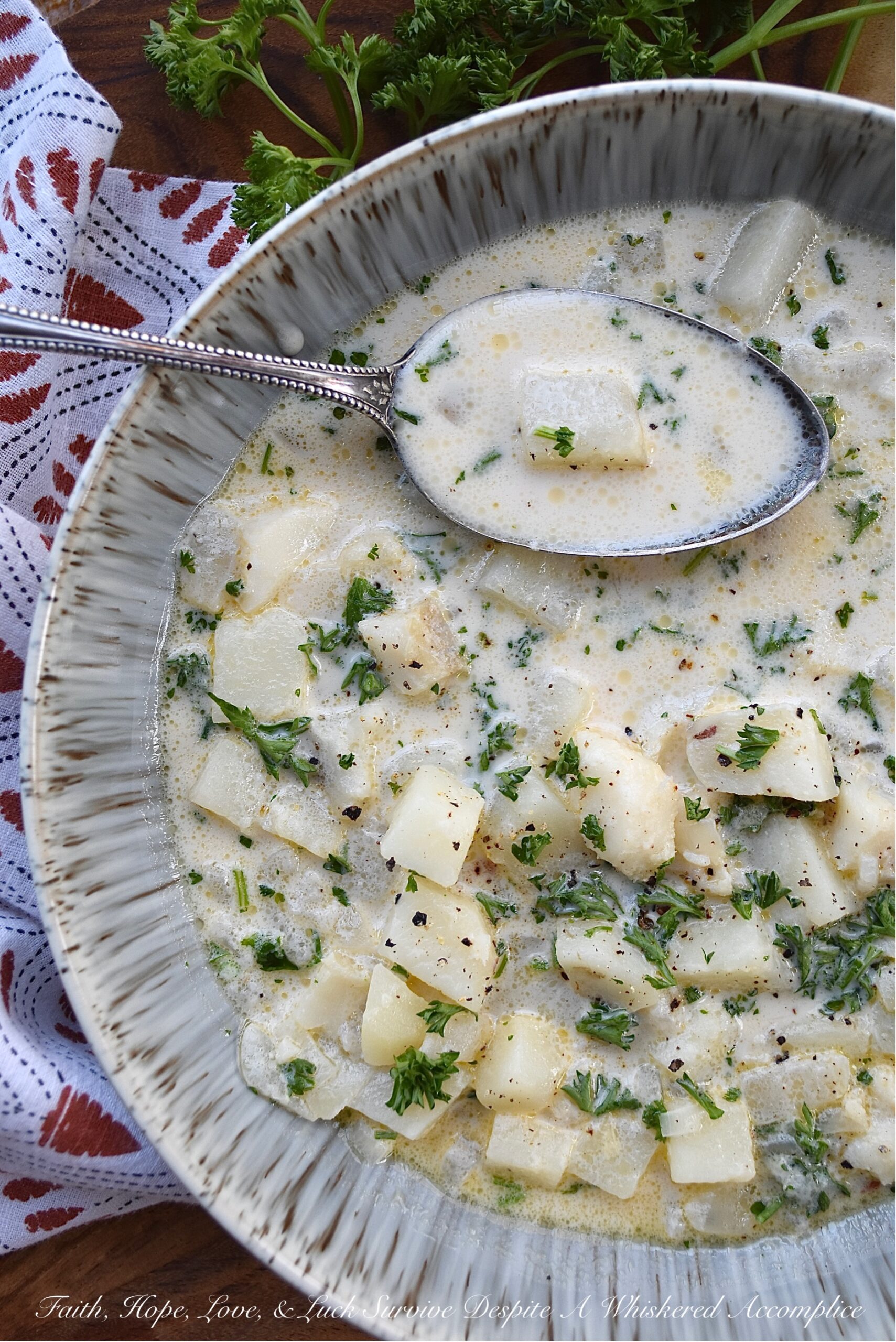 Fish & Potato Chowder with Irish Whiskey - This one-pot fish chowder is an easy-to-make recipe that uses bite-sized chunks of skinless boneless cod, peeled red potatoes, and a touch of Irish whiskey for added flavor. For the broth, a can of evaporated milk, a little bit of half and half, and a few tablespoons of butter help give this chowder a lovely creaminess, without making it over-the-top rich. This is a meal you can easily serve for Fish Friday, St. Patrick's Day, or even on a normal hectic weekday evening.