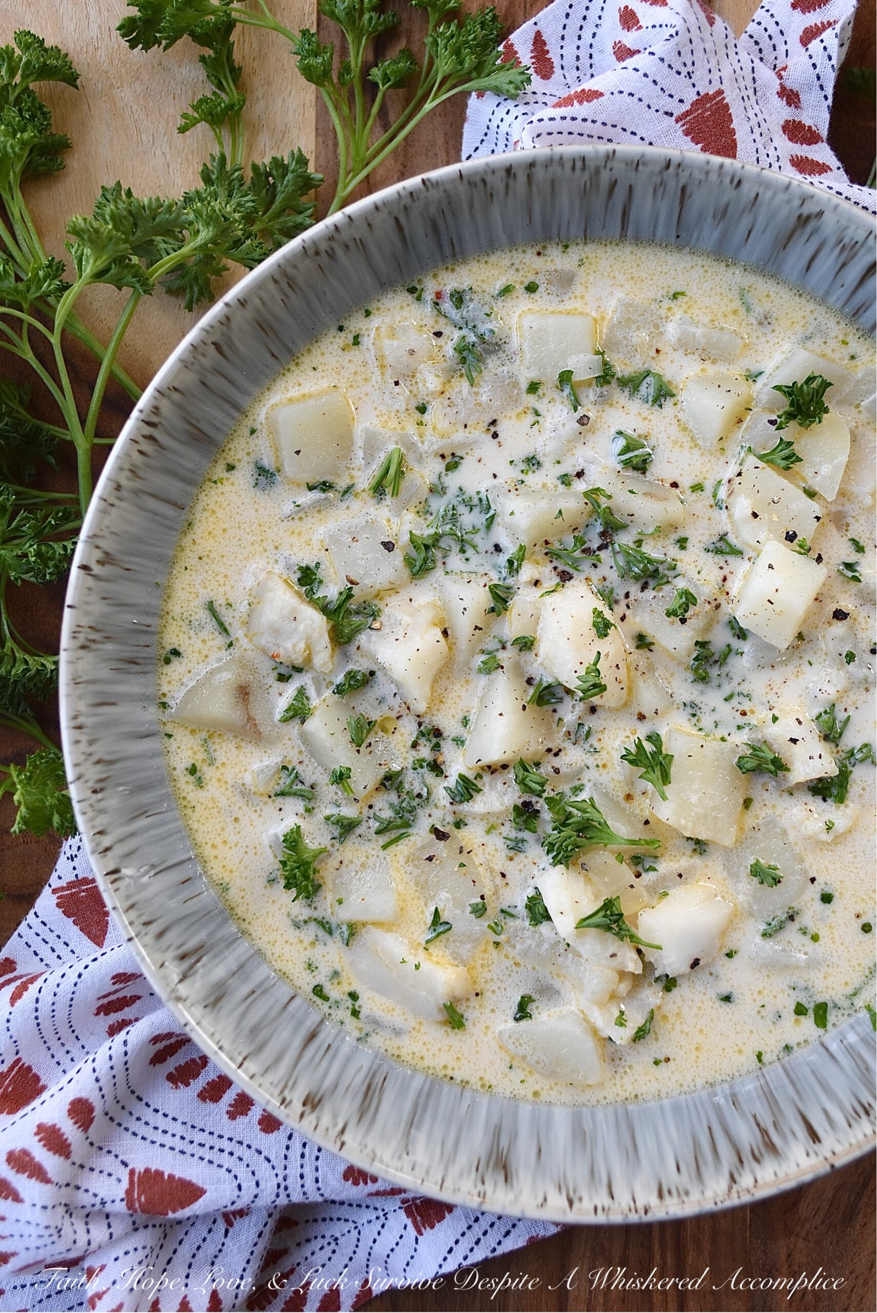 Fish & Potato Chowder with Irish Whiskey - This one-pot fish chowder is an easy-to-make recipe that uses bite-sized chunks of skinless boneless cod, peeled red potatoes, and a touch of Irish whiskey for added flavor. For the broth, a can of evaporated milk, a little bit of half and half, and a few tablespoons of butter help give this chowder a lovely creaminess, without making it over-the-top rich. This is a meal you can easily serve for Fish Friday, St. Patrick's Day, or even on a normal hectic weekday evening.