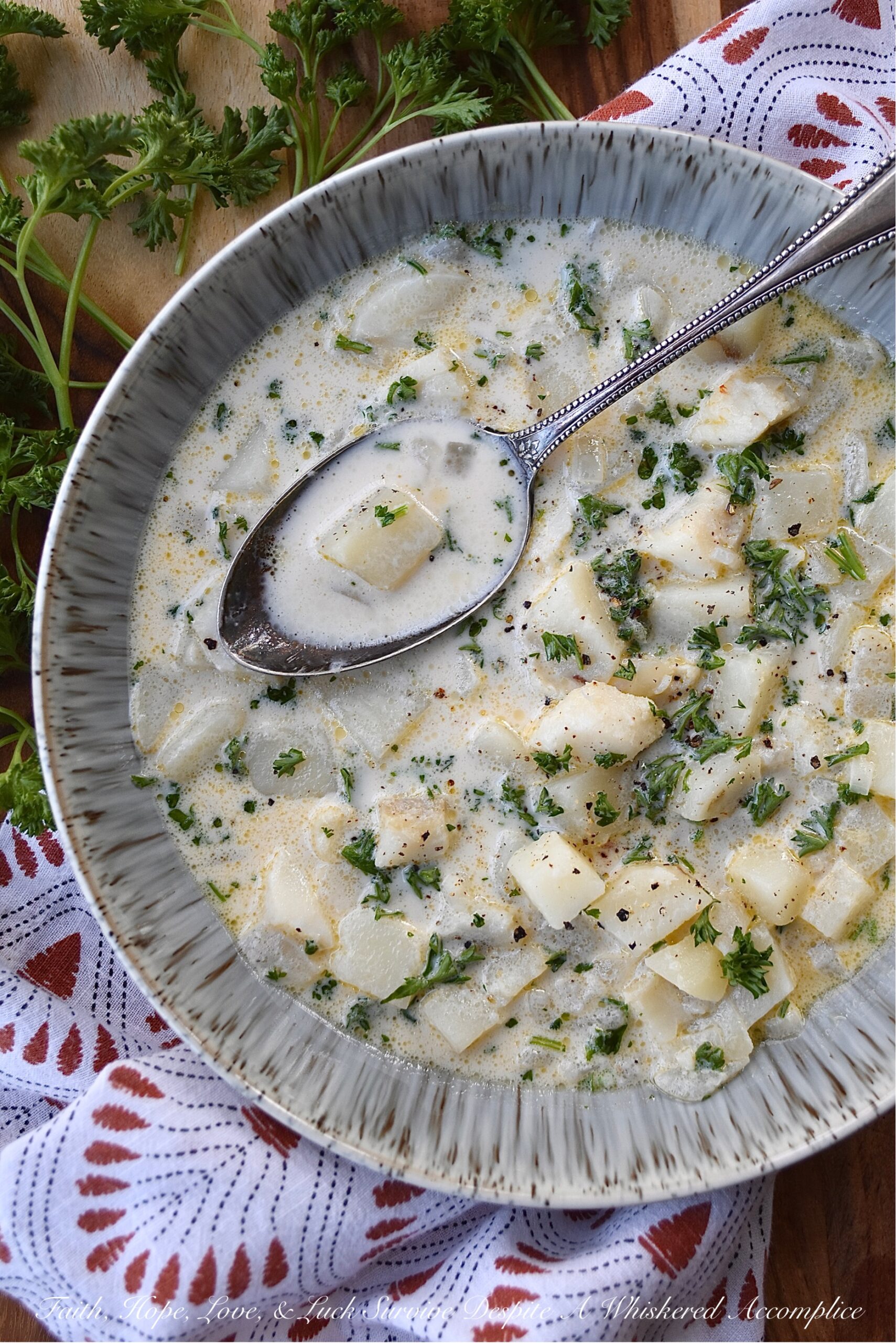 Fish & Potato Chowder with Irish Whiskey - This one-pot fish chowder is an easy-to-make recipe that uses bite-sized chunks of skinless boneless cod, peeled red potatoes, and a touch of Irish whiskey for added flavor. For the broth, a can of evaporated milk, a little bit of half and half, and a few tablespoons of butter help give this chowder a lovely creaminess, without making it over-the-top rich. This is a meal you can easily serve for Fish Friday, St. Patrick's Day, or even on a normal hectic weekday evening.