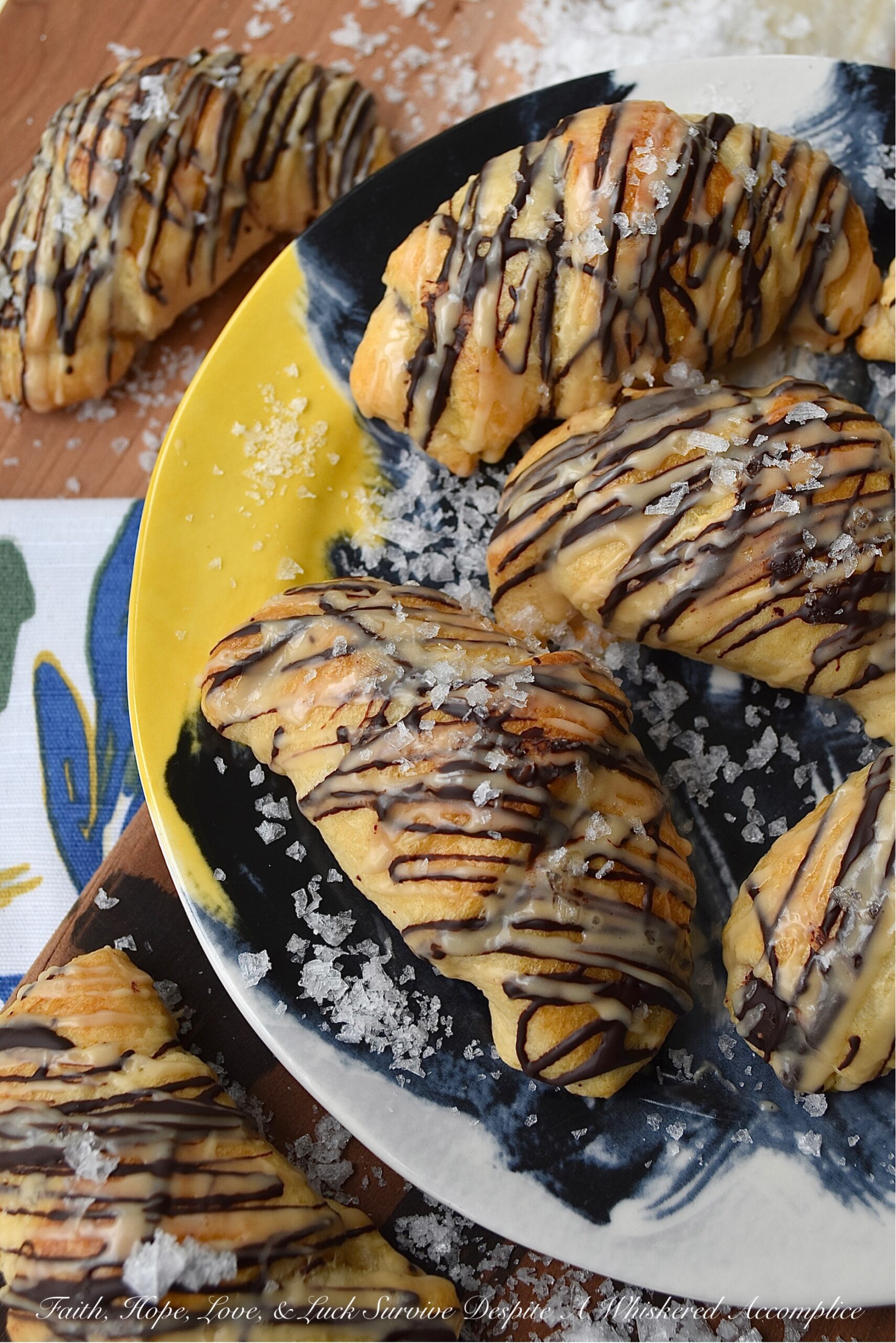 Chocolate Crescent Rolls with Baileys & Sea Salt - When you wake up and find yourself in need of a sweet treat but don't feel like spending all morning in the kitchen, these chocolate crescent rolls are just what you need. Store-bought crescent rolls are filled with chopped chocolate, baked until golden brown, and then drizzled with both additional melted chocolate and a sweet Baileys Irish Cream glaze. A little sprinkle of sea salt is the final and flavorful touch to help make this breakfast, brunch, or dessert treat simply irresistible.