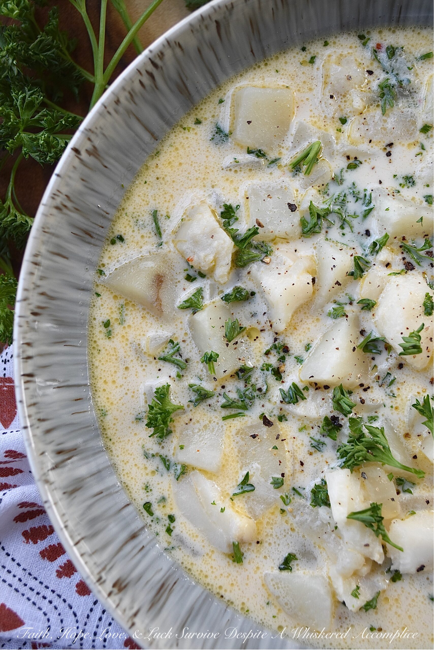 Fish & Potato Chowder with Irish Whiskey - This one-pot fish chowder is an easy-to-make recipe that uses bite-sized chunks of skinless boneless cod, peeled red potatoes, and a touch of Irish whiskey for added flavor. For the broth, a can of evaporated milk, a little bit of half and half, and a few tablespoons of butter help give this chowder a lovely creaminess, without making it over-the-top rich. This is a meal you can easily serve for Fish Friday, St. Patrick's Day, or even on a normal hectic weekday evening.