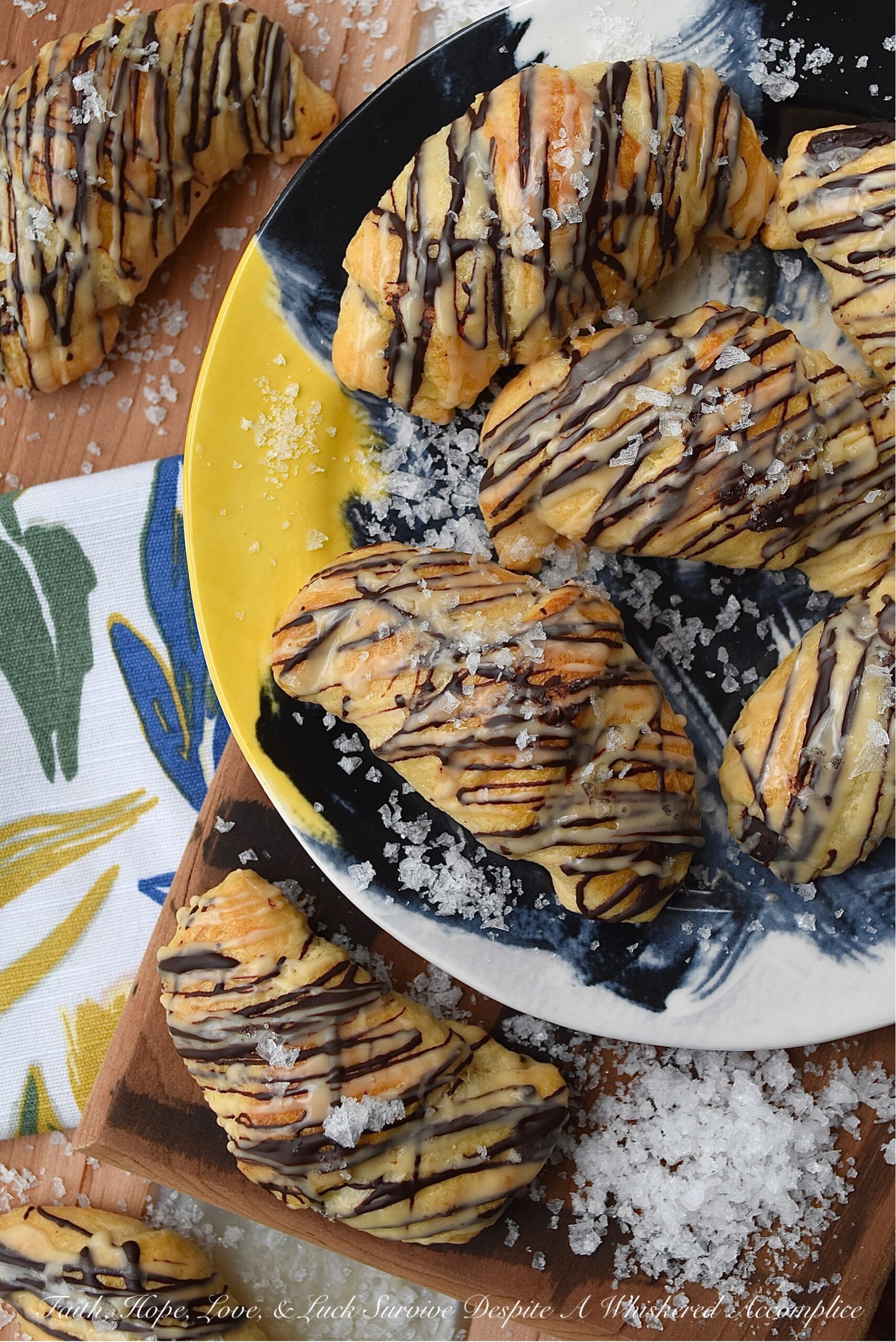 Chocolate Crescent Rolls with Baileys & Sea Salt - When you wake up and find yourself in need of a sweet treat but don't feel like spending all morning in the kitchen, these chocolate crescent rolls are just what you need. Store-bought crescent rolls are filled with chopped chocolate, baked until golden brown, and then drizzled with both additional melted chocolate and a sweet Baileys Irish Cream glaze. A little sprinkle of sea salt is the final and flavorful touch to help make this breakfast, brunch, or dessert treat simply irresistible.
