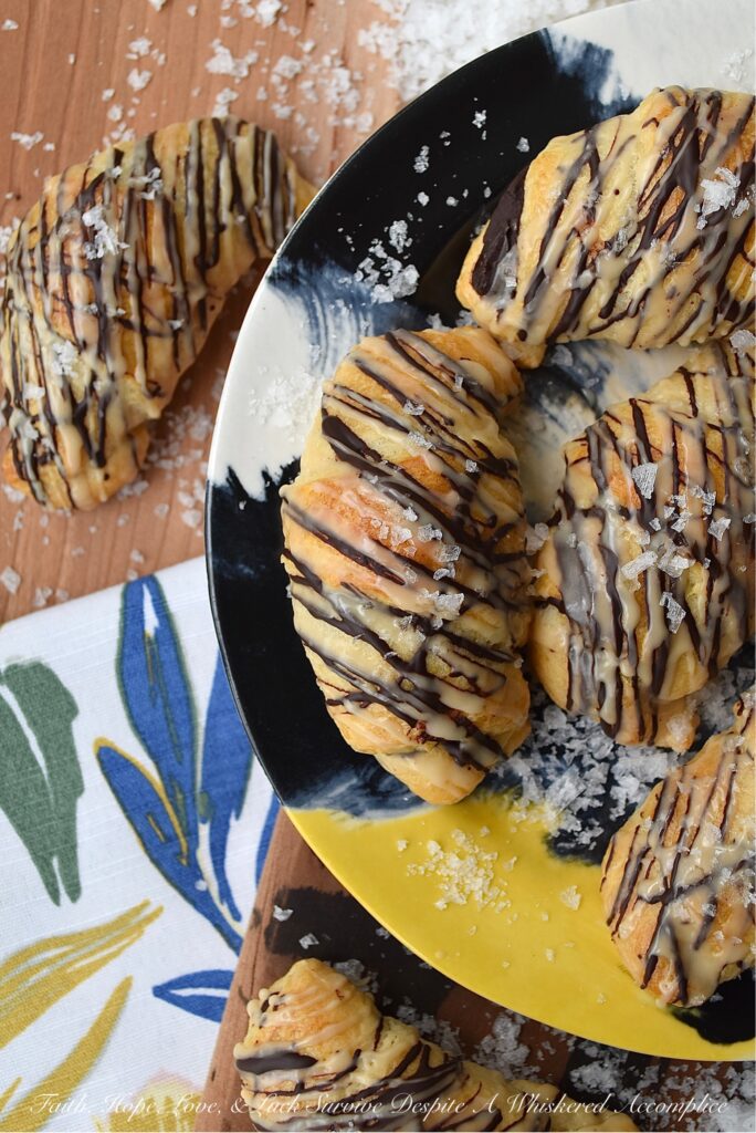 Chocolate Crescent Rolls with Baileys & Sea Salt - When you wake up and find yourself in need of a sweet treat but don't feel like spending all morning in the kitchen, these chocolate crescent rolls are just what you need. Store-bought crescent rolls are filled with chopped chocolate, baked until golden brown, and then drizzled with both additional melted chocolate and a sweet Baileys Irish Cream glaze. A little sprinkle of sea salt is the final and flavorful touch to help make this breakfast, brunch, or dessert treat simply irresistible.