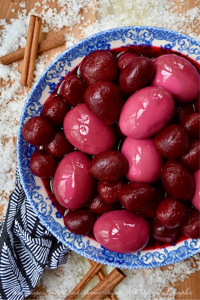Easy 4-Ingredient Pickled Eggs with Beets - If you're a true pickled egg devotee, this easy 4-ingredient recipe is about to make all of your pickled egg dreams come true. Instead of cooking, peeling, and pickling beets each time you want to enjoy a few pickled eggs, simply use a few jars of store-bought whole or sliced pickled beets instead. For added flavor, add a few cinnamon sticks and a bit of sea salt. These pickled hard-boiled eggs are easy to prepare, absolutely delicious, and won't leave you with beet-stained hands.