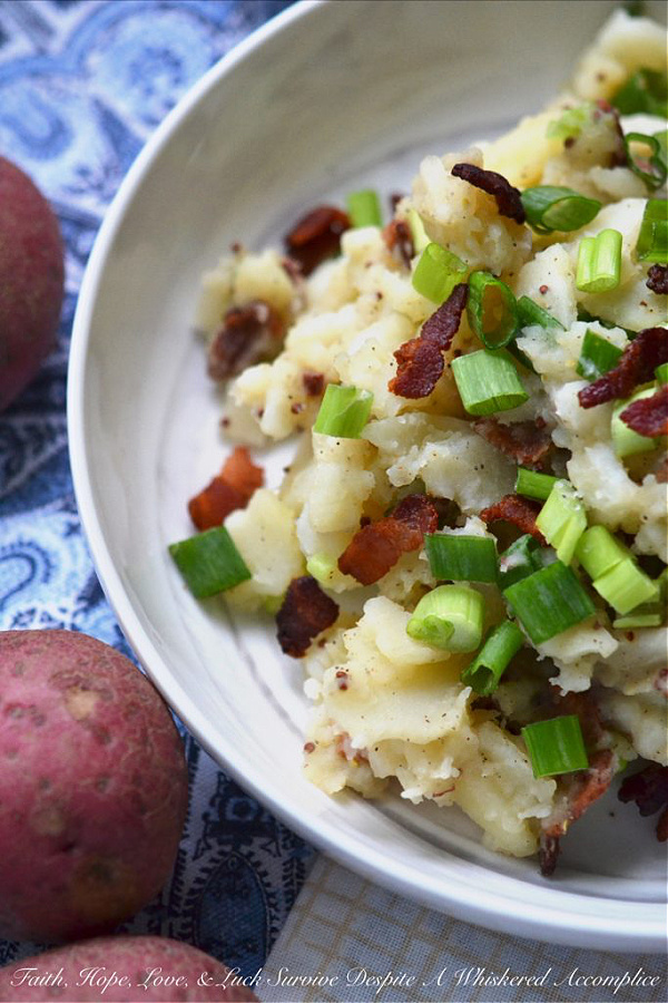 Hot German Potato Salad with Bacon - This hot potato salad is given a sweet and tangy German twist by using a simple Dijon and whole grain mustard vinaigrette along with crispy crumbled bacon. If you're searching for a no-mayonnaise side dish recipe for your next barbecue or cookout, this German potato salad is a great option.