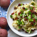 Hot German Potato Salad with Bacon - This hot potato salad is given a sweet and tangy German twist by using a simple Dijon and whole grain mustard vinaigrette along with crispy crumbled bacon. If you're searching for a no-mayonnaise side dish recipe for your next barbecue or cookout, this German potato salad is a great option.