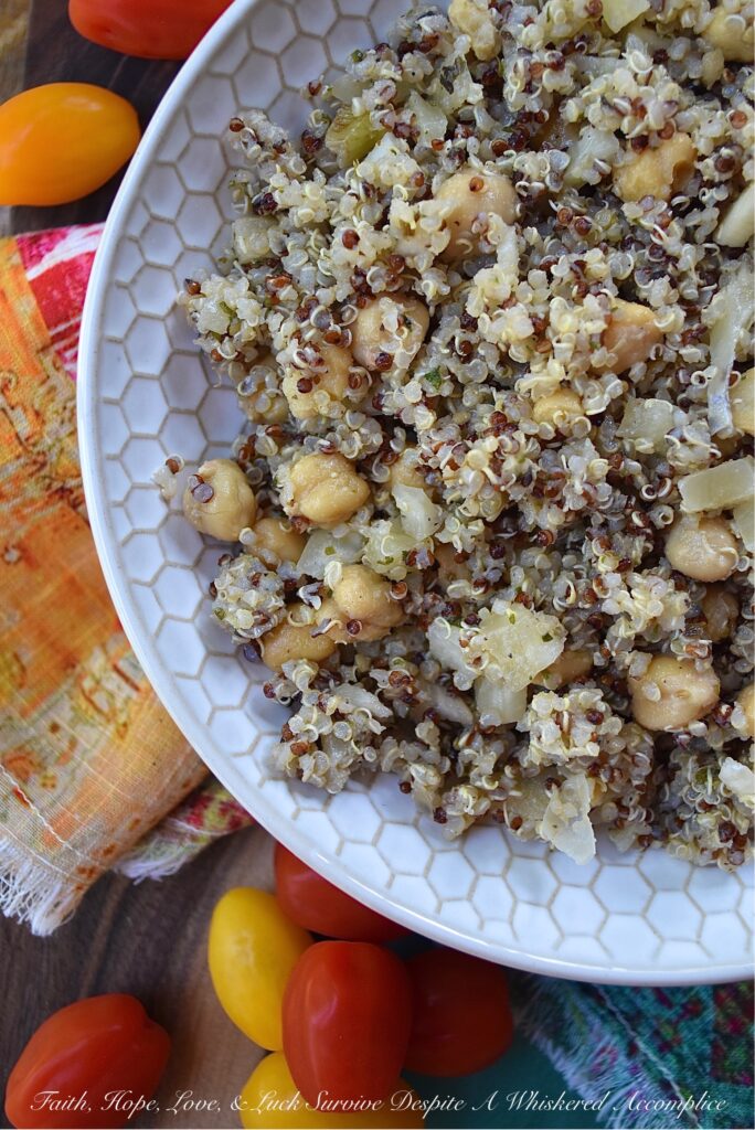 Quinoa Salad with Fennel & Garbanzo Beans - Are you bored with the same dull and unimaginative traditional pasta salad, coleslaw, and potato salad recipes? Are you searching for a side dish with a little more personality, that's still healthy, filling, and flavorful? Then this quinoa salad recipe is definitely one that you need to check out. With garbanzo beans, dried herbs, and finely chopped fennel, this rainbow quinoa salad is anything but dull, bland, or unimaginative. And, since adding extra ingredients is so easy, you can switch up the flavor each time you make it. Some of our favorite add-in suggestions include feta cheese, halved cherry tomatoes, and kalamata olives.