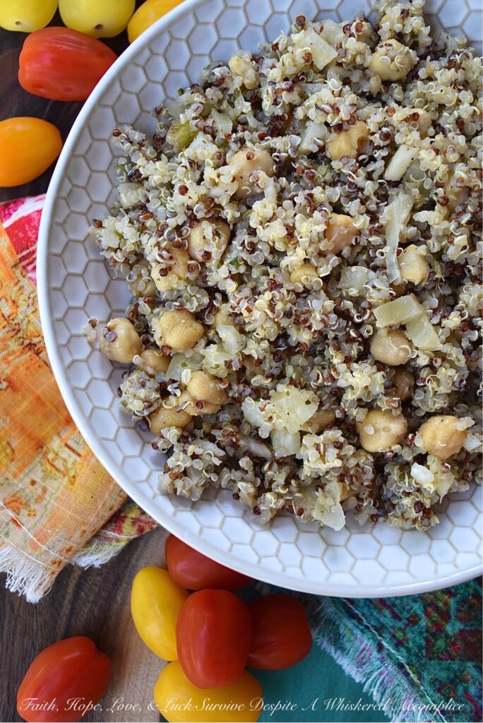 Quinoa Salad with Fennel & Garbanzo Beans - Are you bored with the same dull and unimaginative traditional pasta salad, coleslaw, and potato salad recipes? Are you searching for a side dish with a little more personality, that's still healthy, filling, and flavorful? Then this quinoa salad recipe is definitely one that you need to check out. With garbanzo beans, dried herbs, and finely chopped fennel, this rainbow quinoa salad is anything but dull, bland, or unimaginative. And, since adding extra ingredients is so easy, you can switch up the flavor each time you make it. Some of our favorite add-in suggestions include feta cheese, halved cherry tomatoes, and kalamata olives.