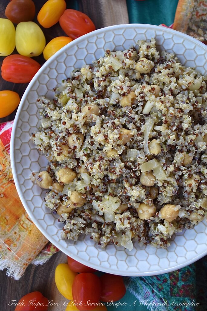 Quinoa Salad with Fennel & Garbanzo Beans - Are you bored with the same dull and unimaginative traditional pasta salad, coleslaw, and potato salad recipes? Are you searching for a side dish with a little more personality, that's still healthy, filling, and flavorful? Then this quinoa salad recipe is definitely one that you need to check out. With garbanzo beans, dried herbs, and finely chopped fennel, this rainbow quinoa salad is anything but dull, bland, or unimaginative. And, since adding extra ingredients is so easy, you can switch up the flavor each time you make it. Some of our favorite add-in suggestions include feta cheese, halved cherry tomatoes, and kalamata olives.