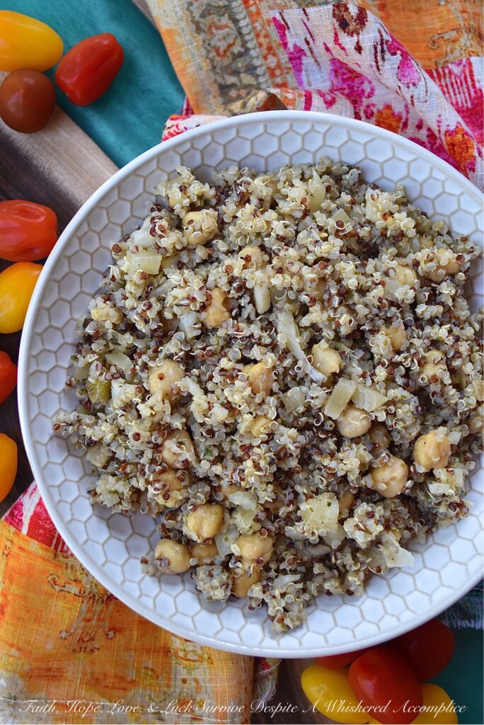 Quinoa Salad with Fennel & Garbanzo Beans - Are you bored with the same dull and unimaginative traditional pasta salad, coleslaw, and potato salad recipes? Are you searching for a side dish with a little more personality, that's still healthy, filling, and flavorful? Then this quinoa salad recipe is definitely one that you need to check out. With garbanzo beans, dried herbs, and finely chopped fennel, this rainbow quinoa salad is anything but dull, bland, or unimaginative. And, since adding extra ingredients is so easy, you can switch up the flavor each time you make it. Some of our favorite add-in suggestions include feta cheese, halved cherry tomatoes, and kalamata olives.