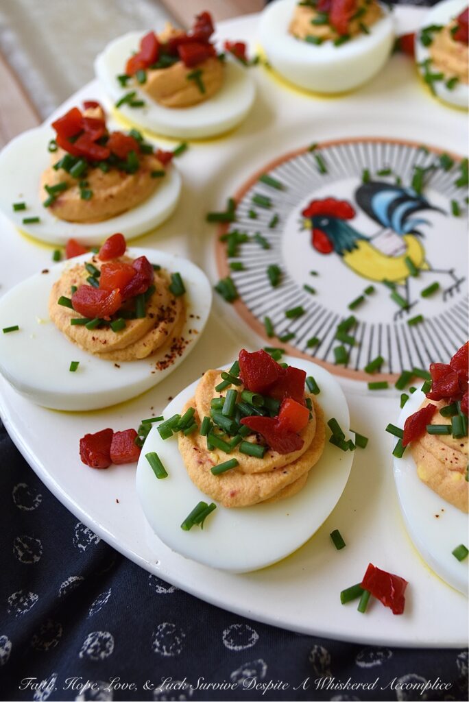 Sweet Pimento Deviled Eggs - Liven up traditional deviled eggs with the addition of chives and diced pimentos. A little bit of granulated sugar and balsamic vinegar also helps to add sweetness and flavor. For sure, these colorful and sweet deviled eggs with pimento, are bound to be a huge hit at your next holiday, barbecue, picnic, or cookout gathering.