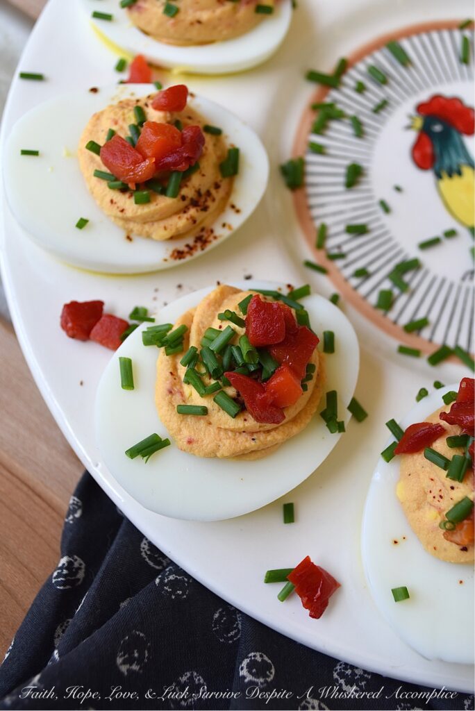 Sweet Pimento Deviled Eggs - Liven up traditional deviled eggs with the addition of chives and diced pimentos. A little bit of granulated sugar and balsamic vinegar also helps to add sweetness and flavor. For sure, these colorful and sweet deviled eggs with pimento, are bound to be a huge hit at your next holiday, barbecue, picnic, or cookout gathering.