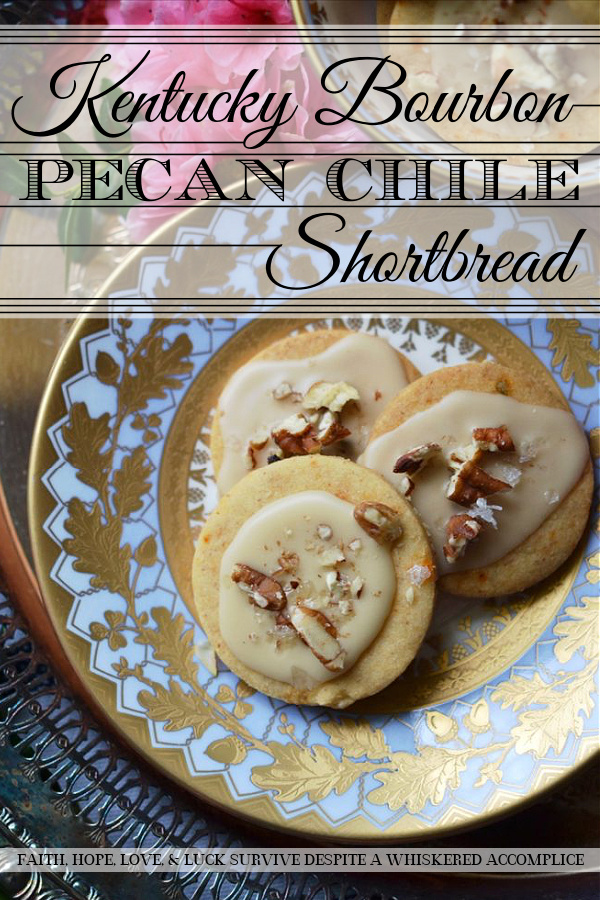 Kentucky Bourbon Pecan Chile Shortbread - A ground guajillo chile and a touch of Kentucky bourbon help to make these crumbly buttery shortbread cookies a tea-time treat you won't soon forget. And as if that weren't enough, a drizzle of vanilla bourbon glaze, a sprinkle of finely chopped pecans, and the littlest pinch of Fleur de Sel help to transform these flavorful shortbread cookies into something even more magical.