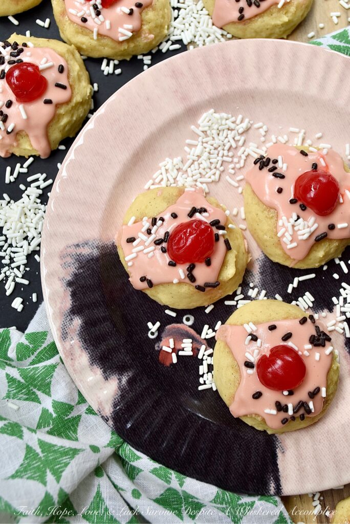 Amish Buttermilk Vanilla Sundae Cookies - These buttermilk Amish cookies are soft, dreamy, flecked with vanilla bean seeds, and covered in a sweet, creamy, decadent cherry juice and vanilla-infused icing. To create charmingly adorable and irresistible cakey sundae cookies no one can resist, simply sprinkle on a few sprinkles and top with half a maraschino cherry.