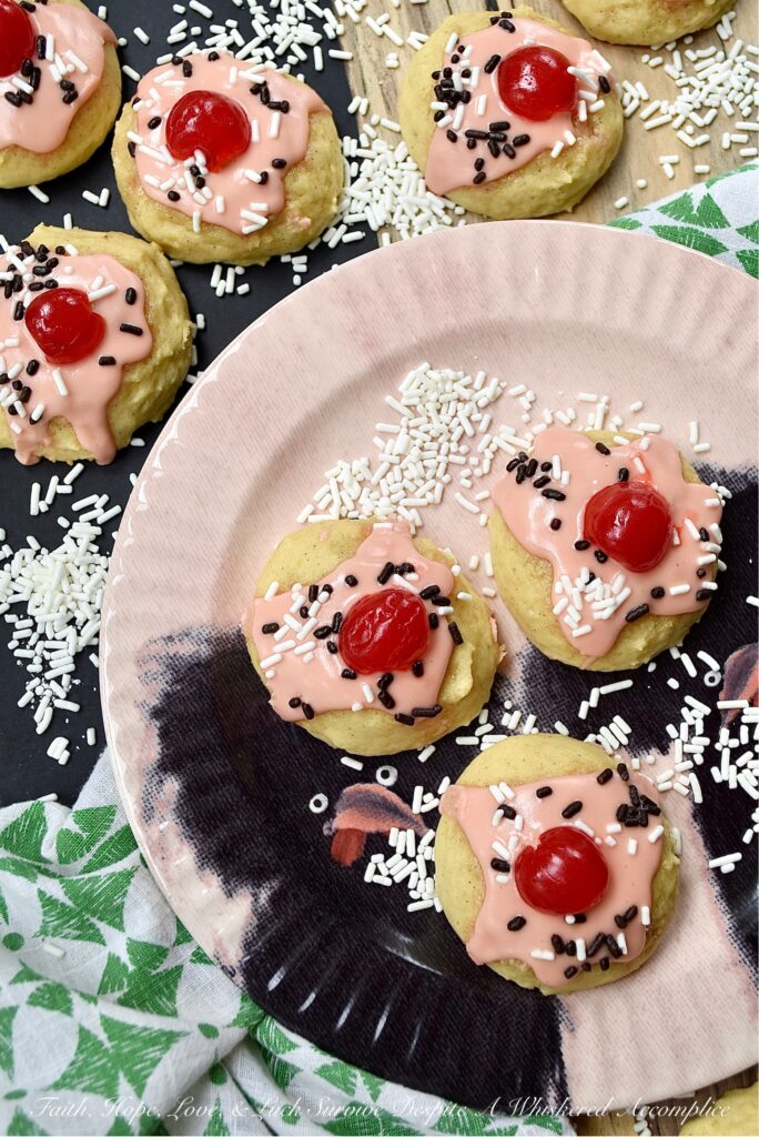 Amish Buttermilk Vanilla Sundae Cookies - These buttermilk Amish cookies are soft, dreamy, flecked with vanilla bean seeds, and covered in a sweet, creamy, decadent cherry juice and vanilla-infused icing. To create charmingly adorable and irresistible cakey sundae cookies no one can resist, simply sprinkle on a few sprinkles and top with half a maraschino cherry.
