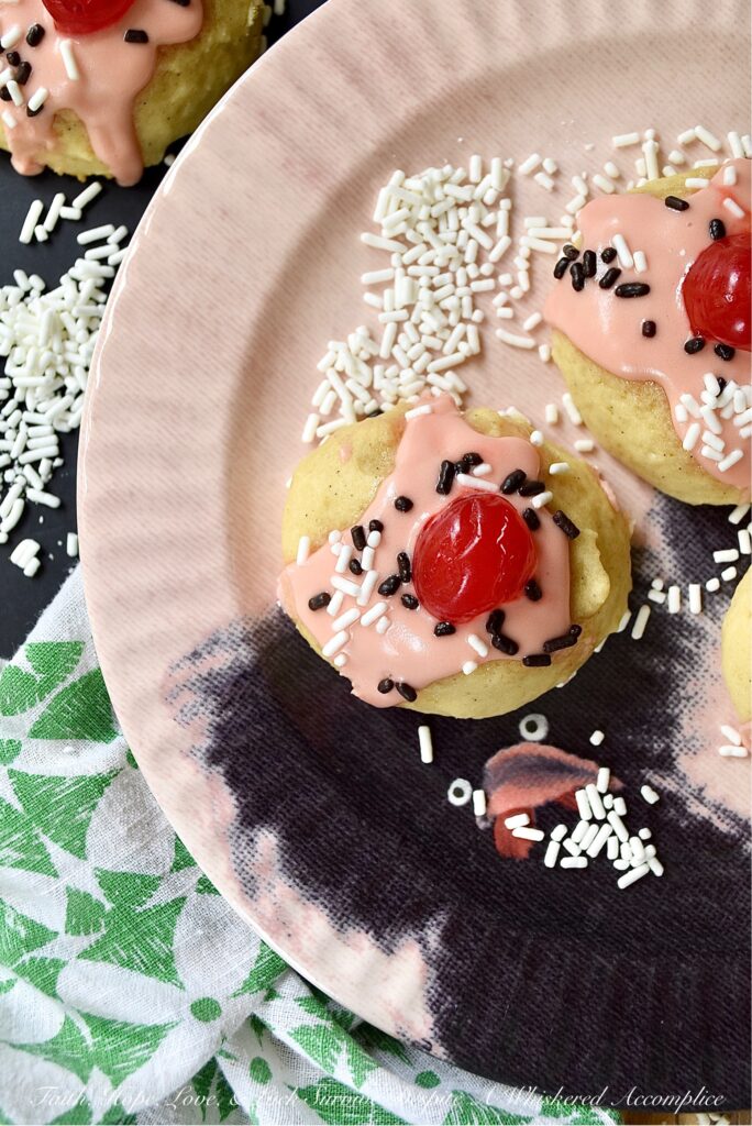 Amish Buttermilk Vanilla Sundae Cookies - These buttermilk Amish cookies are soft, dreamy, flecked with vanilla bean seeds, and covered in a sweet, creamy, decadent cherry juice and vanilla-infused icing. To create charmingly adorable and irresistible cakey sundae cookies no one can resist, simply sprinkle on a few sprinkles and top with half a maraschino cherry.