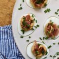 Honey BBQ Seasoned Deviled Eggs with Bacon - These honey barbeque-seasoned deviled eggs with bacon are a must-try. With a touch of honey and the perfect amount of homemade BBQ seasoning, these deviled eggs are a sweet and flavorful addition to almost any meal. And, the crispy bacon and fresh chives that these eggs are garnished with add a nice touch of crunch and freshness to each and every bite. Whether you're serving these as an appetizer or a side dish, this deviled egg recipe is sure to be a crowd-pleaser.