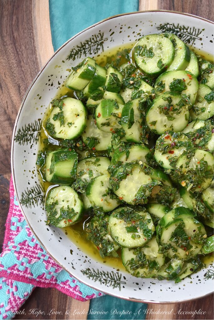 Spicy Mojito Cucumber Salad - Everyone needs a quick, affordable, refreshing summer salad recipe that can be made last minute with minimal effort involved. This crunchy, spicy mojito cucumber salad, tossed in a simple mojito-inspired dressing, is the perfect summertime recipe. It takes less than five minutes to make, requires only a few inexpensive ingredients, and can withstand the hottest summer temps.
