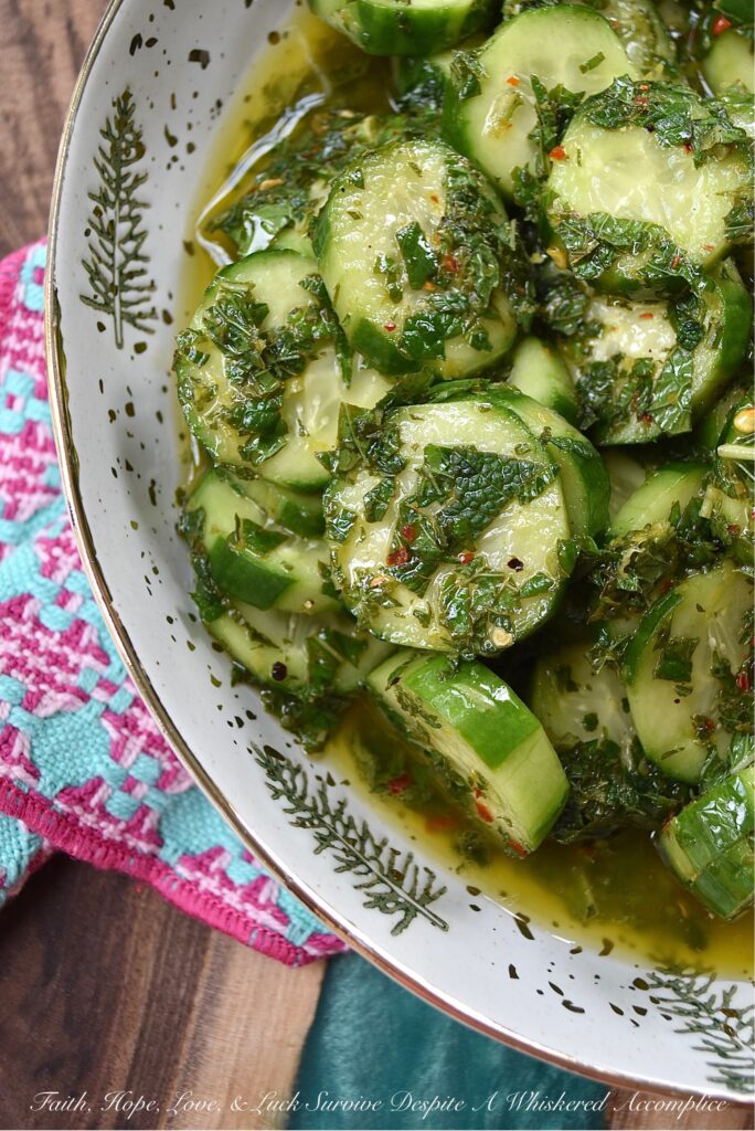 Spicy Mojito Cucumber Salad - Everyone needs a quick, affordable, refreshing summer salad recipe that can be made last minute with minimal effort involved. This crunchy, spicy mojito cucumber salad, tossed in a simple mojito-inspired dressing, is the perfect summertime recipe. It takes less than five minutes to make, requires only a few inexpensive ingredients, and can withstand the hottest summer temps.