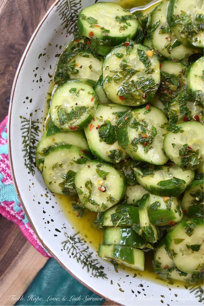 Spicy Mojito Cucumber Salad - Everyone needs a quick, affordable, refreshing summer salad recipe that can be made last minute with minimal effort involved. This crunchy, spicy mojito cucumber salad, tossed in a simple mojito-inspired dressing, is the perfect summertime recipe. It takes less than five minutes to make, requires only a few inexpensive ingredients, and can withstand the hottest summer temps.