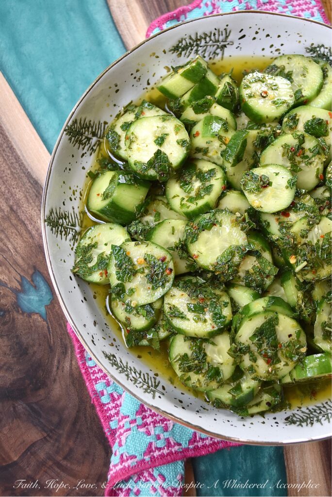 Spicy Mojito Cucumber Salad - Everyone needs a quick, affordable, refreshing summer salad recipe that can be made last minute with minimal effort involved. This crunchy, spicy mojito cucumber salad, tossed in a simple mojito-inspired dressing, is the perfect summertime recipe. It takes less than five minutes to make, requires only a few inexpensive ingredients, and can withstand the hottest summer temps.
