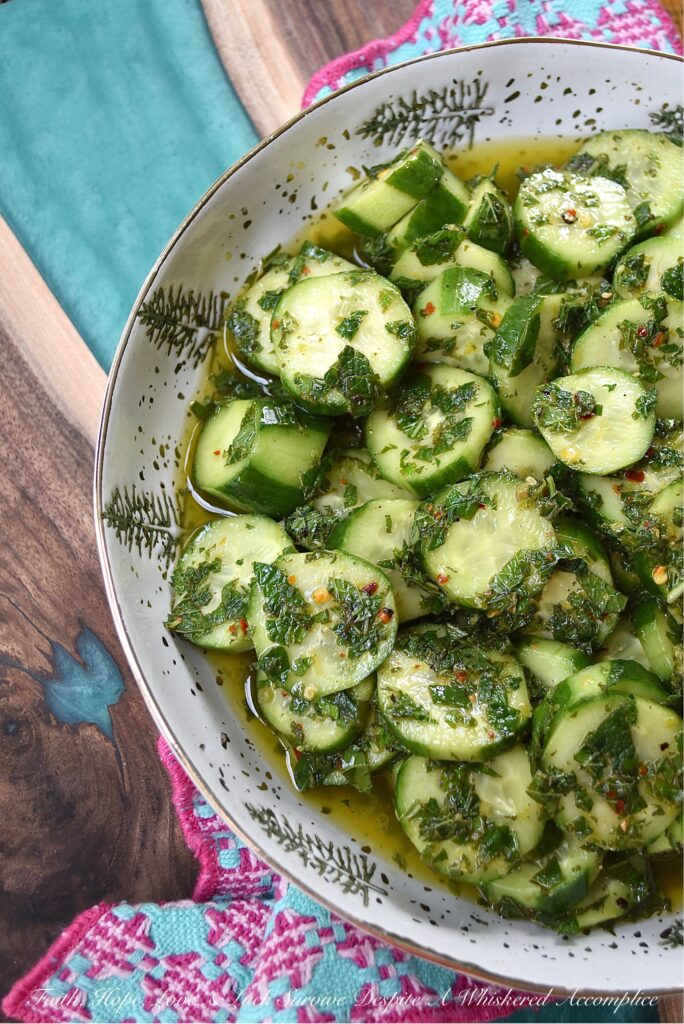 Spicy Mojito Cucumber Salad - Everyone needs a quick, affordable, refreshing summer salad recipe that can be made last minute with minimal effort involved. This crunchy, spicy mojito cucumber salad, tossed in a simple mojito-inspired dressing, is the perfect summertime recipe. It takes less than five minutes to make, requires only a few inexpensive ingredients, and can withstand the hottest summer temps.