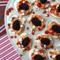 Red, White, & Blue Sweet Pimento Deviled Eggs - These red, white, & blue deviled eggs are the perfect appetizer for your next July 4th celebration. The savory sweetness of the creamy pimento and feta egg filling really helps make this non-traditional deviled egg recipe stand out. And, after these heavenly deviled eggs are garnished with chili powder, pimentos, feta, and perfectly ripe blackberries, they'll be just as gorgeous as they are delicious.