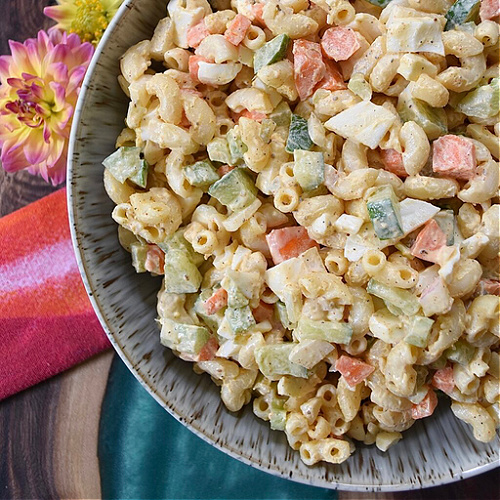The Best Creamy Classic Macaroni Salad - Favorite Summertime Pasta Salad Recipes - What would summertime be without an enormous bowl of creamy homemade pasta salad? They're easy to make, can be made for almost any sized crowd, taste so much better than store-bought, and can be made to fit almost any budget. Here, you'll find some of our favorite summer macaroni, tortellini, and couscous pasta salad recipes, just perfect for your next cookout, picnic, reunion, pool party, or barbeque get-together.